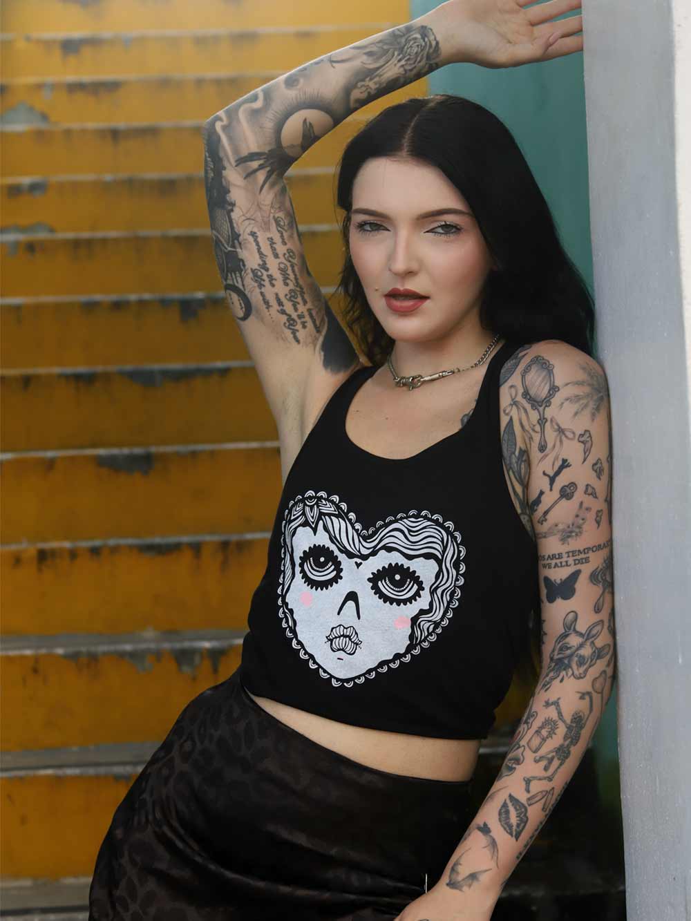 Wearing Women’s Racerback Tank with cute Heart Face Graphic