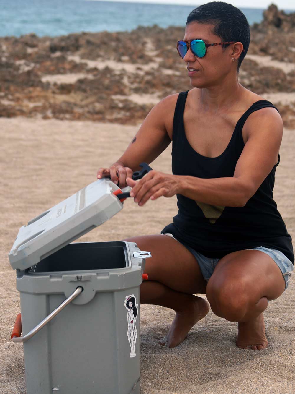 Black tank Top at Beach with Cooler