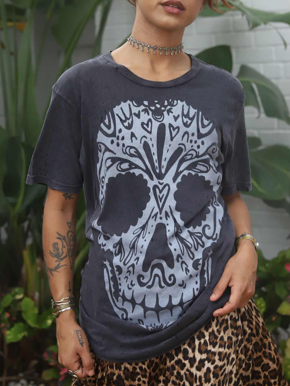 Woman wearing a Calavera graphic Tee