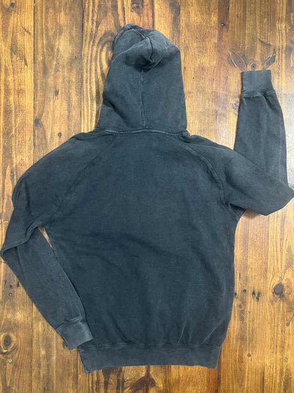 Black hoodie on a wooden surface