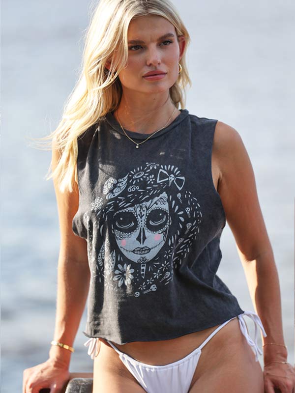model wearing a black vintage crop top with Catrina graphic