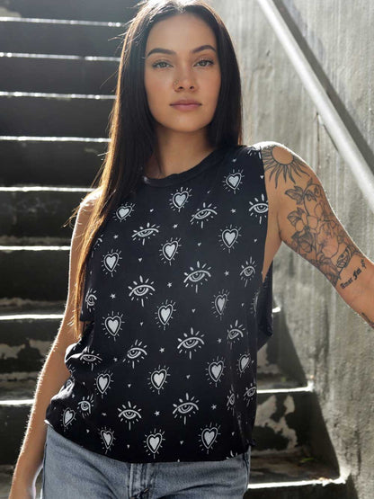 Model wearing a vintage black crop top with heart and third eye patterns. 
