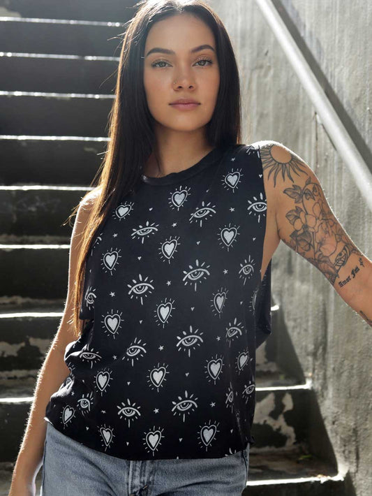 Model wearing a vintage black crop top with heart and third eye patterns. 