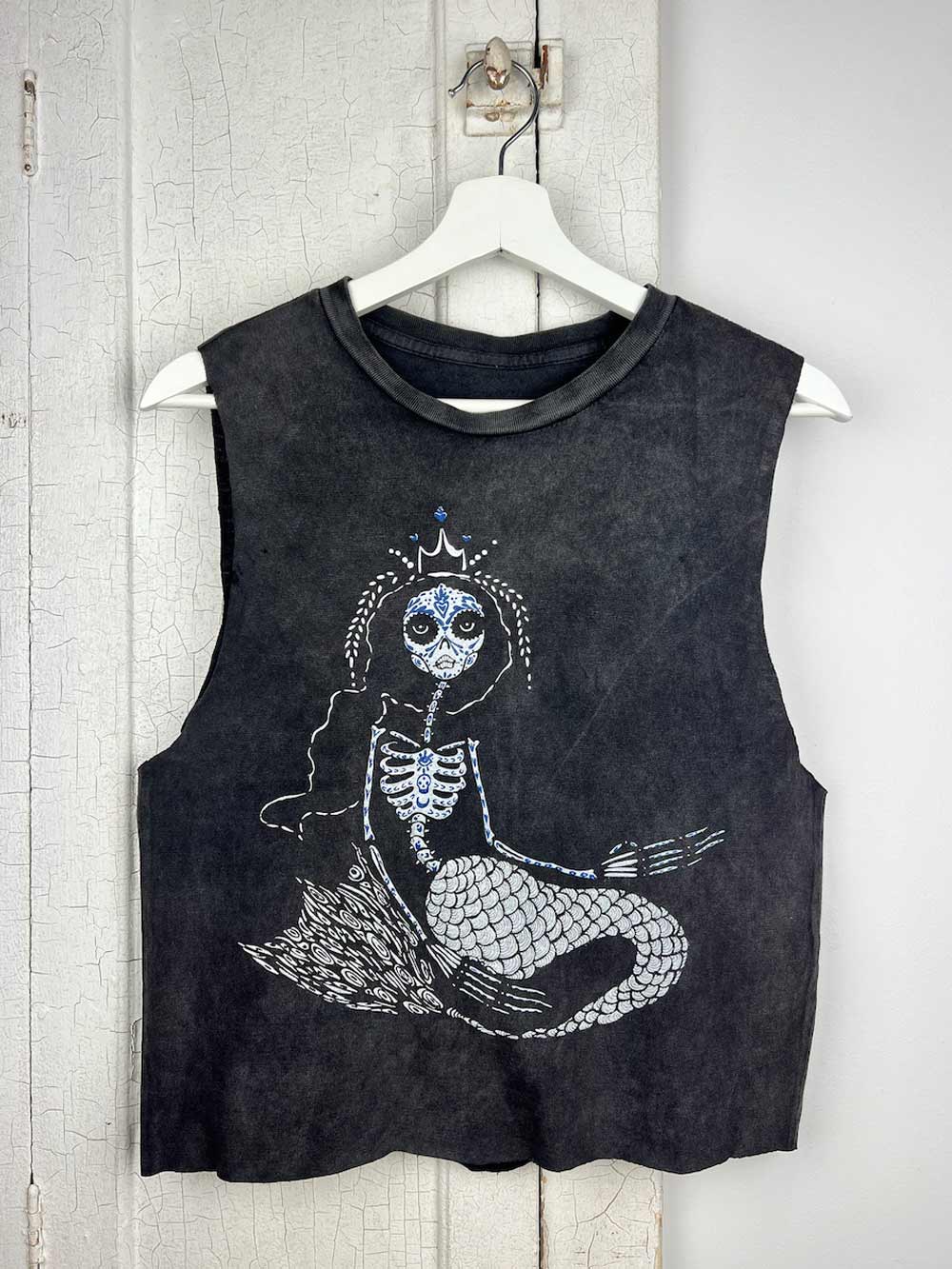 skeleton mermaid crop hanging on door