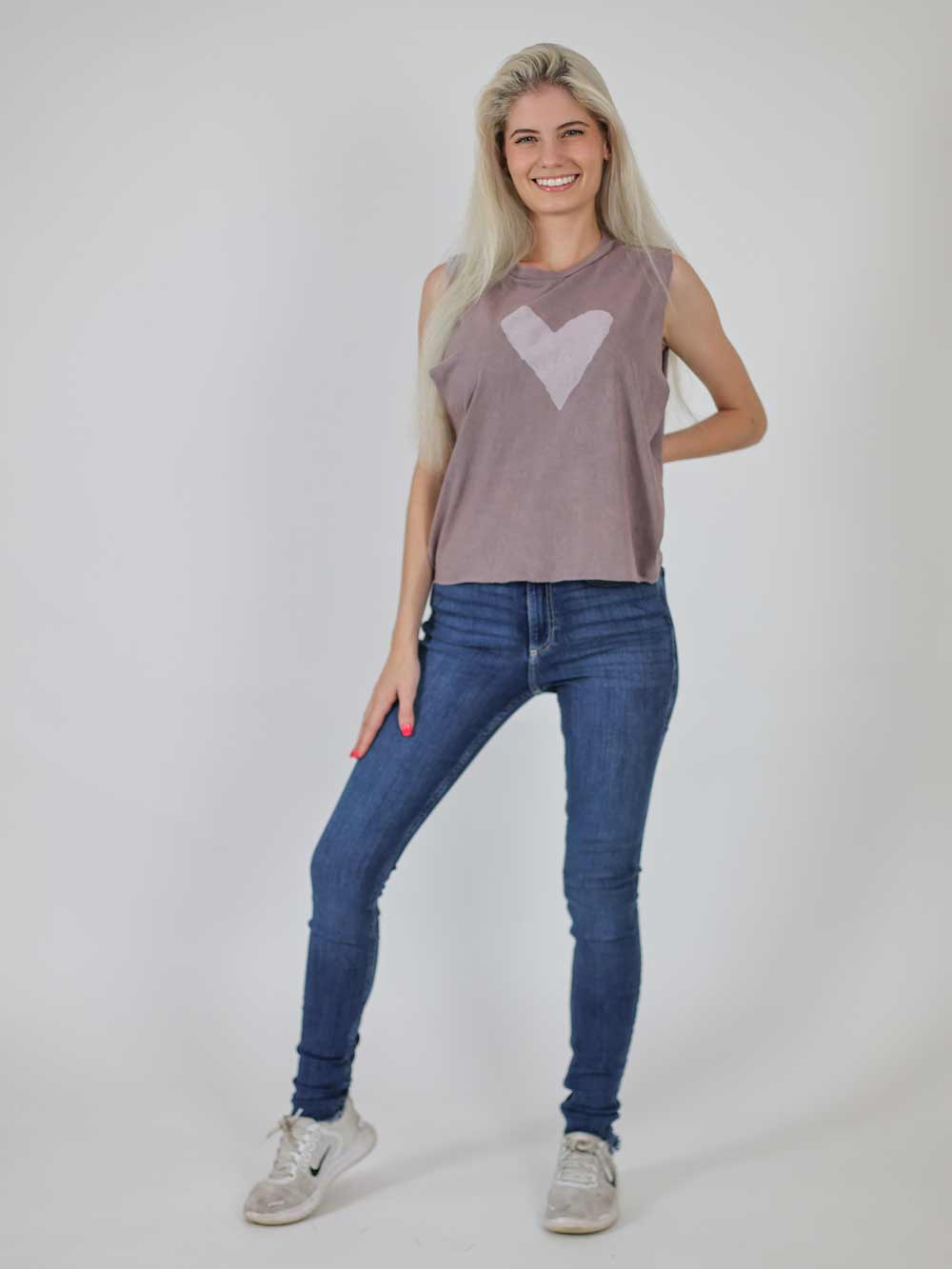 model wearing zinc color crop with white heart graphic