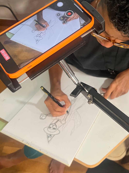 Migdalia recording her drawing a mermaid witch.