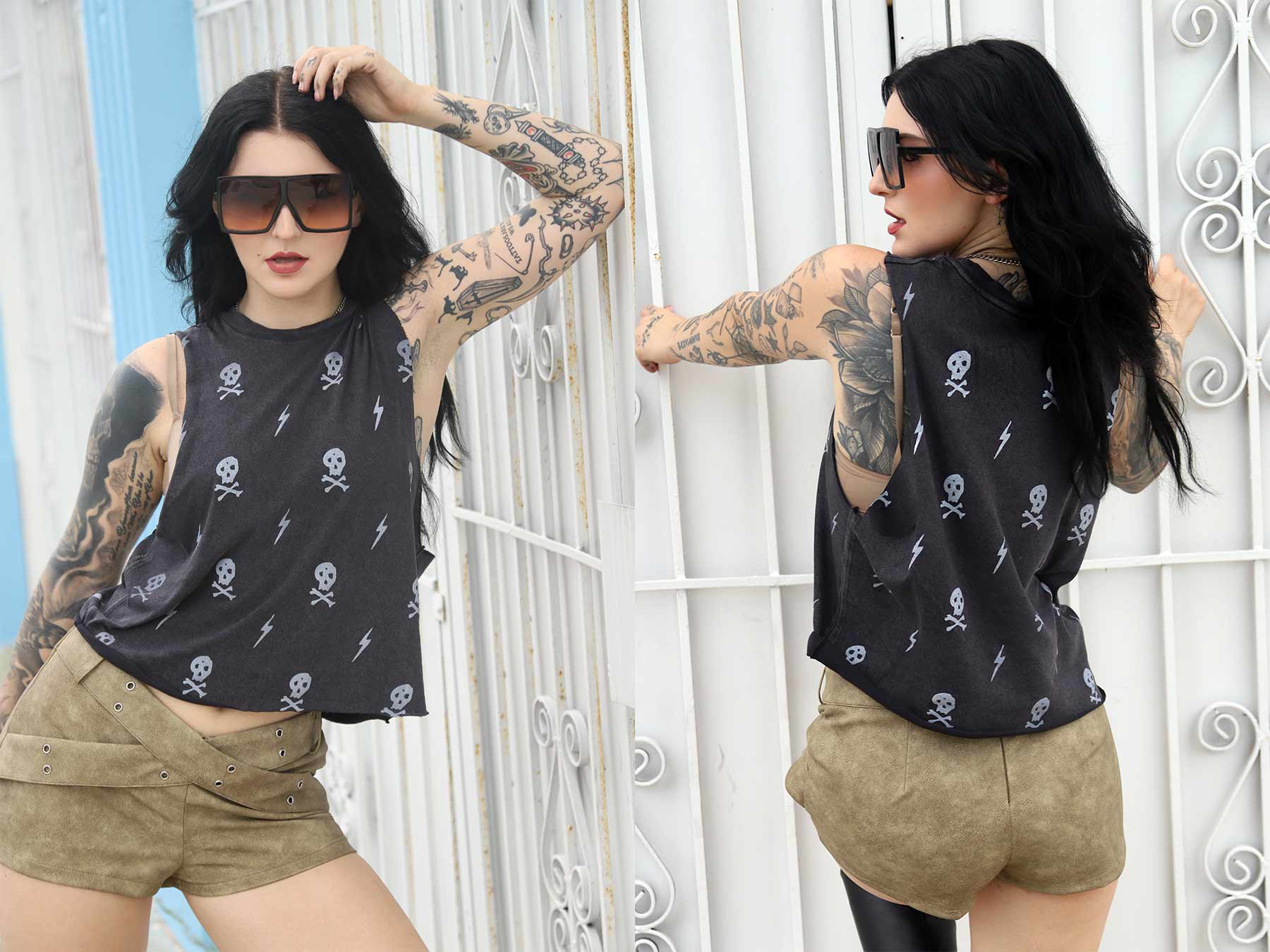 Women wearing black crop top with skulls & lighting bolt pattern in front of a white lattice background.